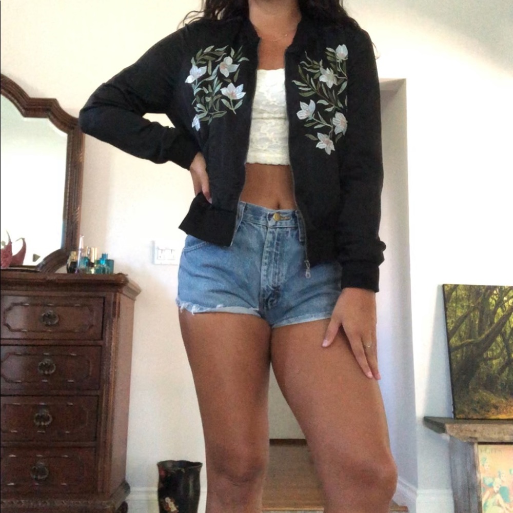 Black bomber jacket with pretty light blue flowers